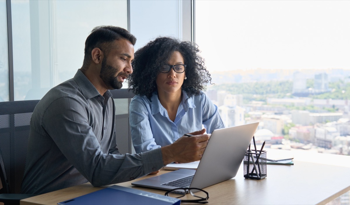 Two People Looking at a Screen