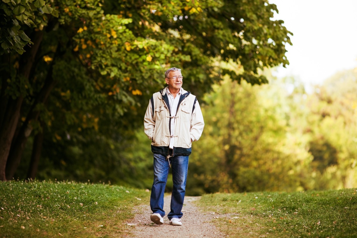 Man walking through park