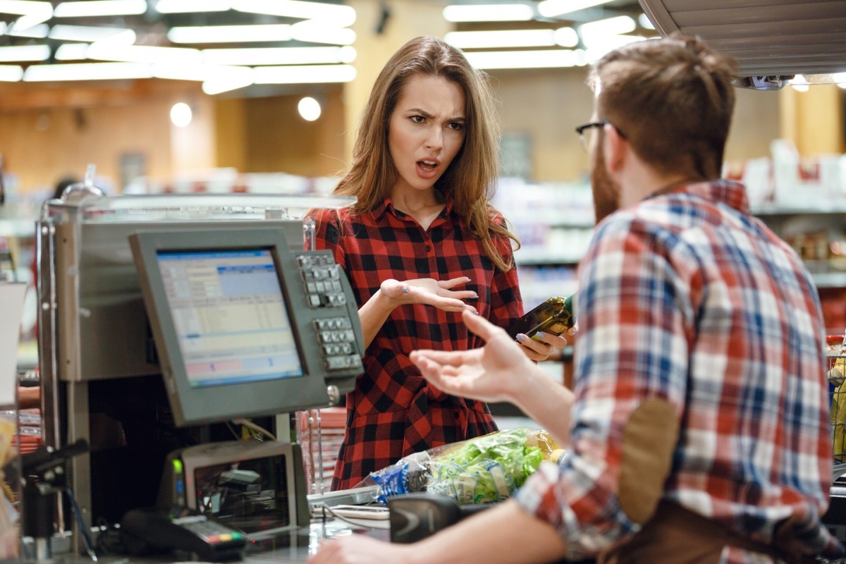 woman yelling at a customer service rep in the grocery store