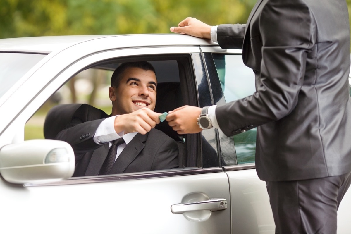 Man giving money to driver