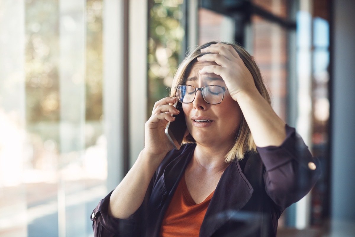 white woman crying on the phone