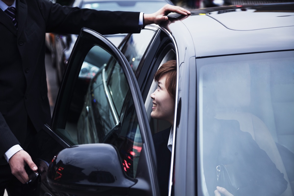 partner holding door open for his spouse