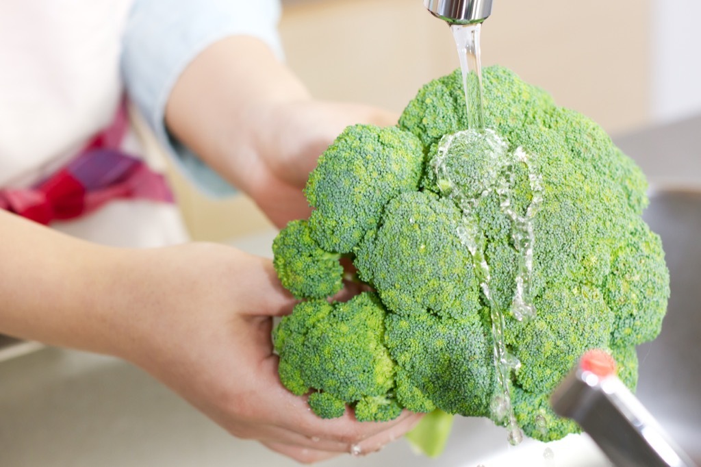 washing broccoli in sink