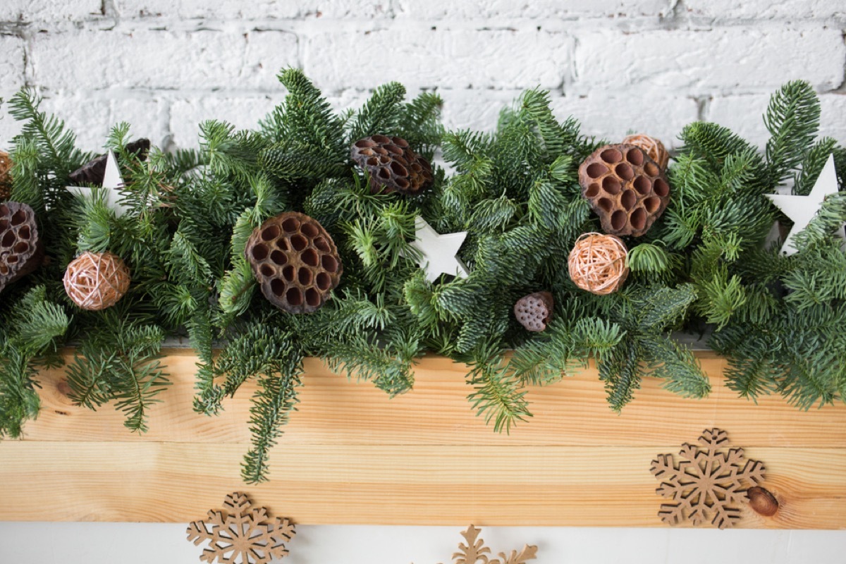 pine garland on wooden mantle