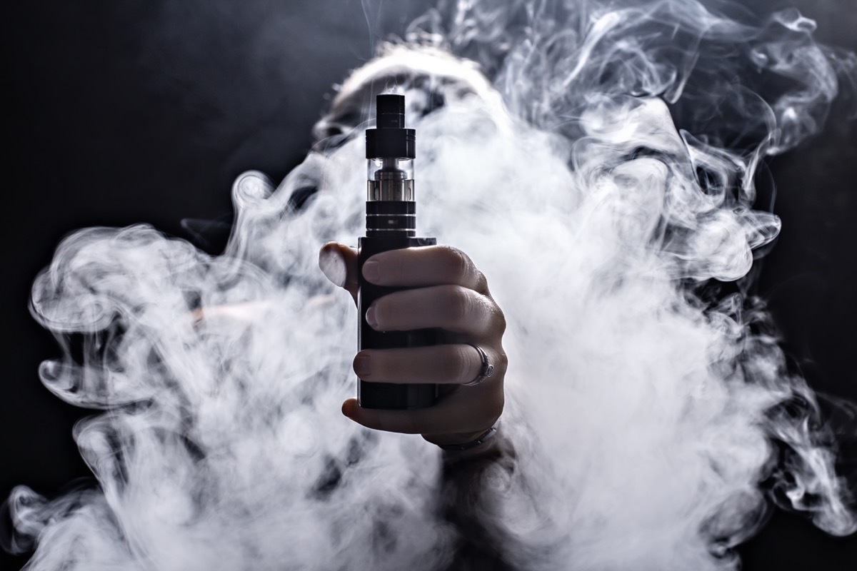 vape and smoke on black background