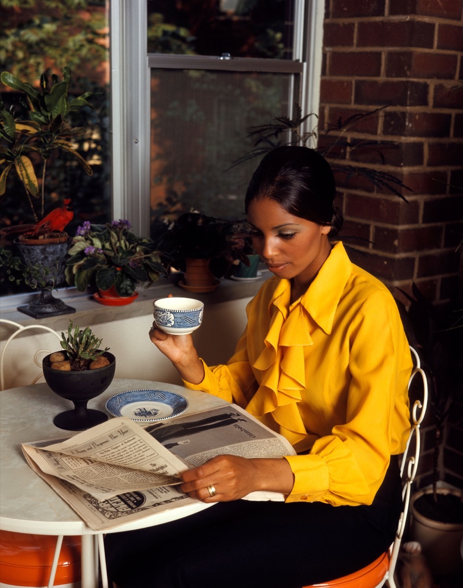 Woman in the 1970s Reading a Newspaper How People Used to Flirt