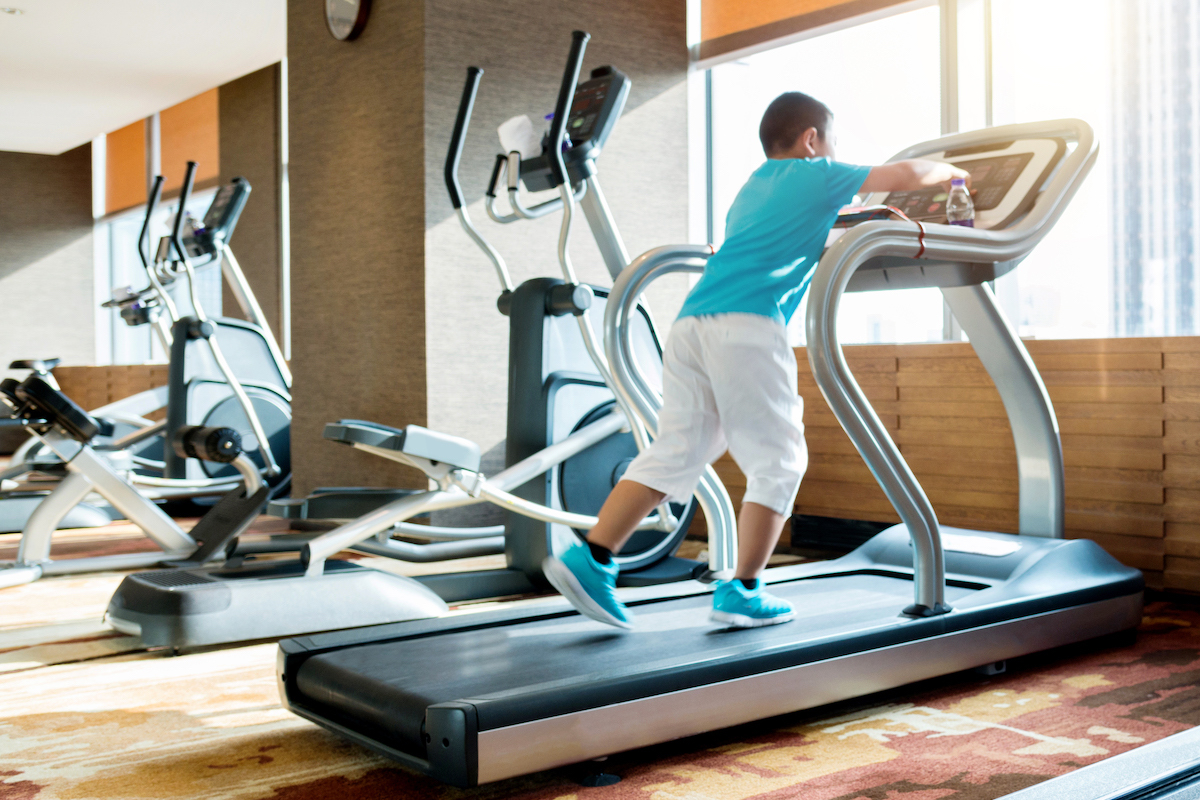 Little boy running on a treadmill