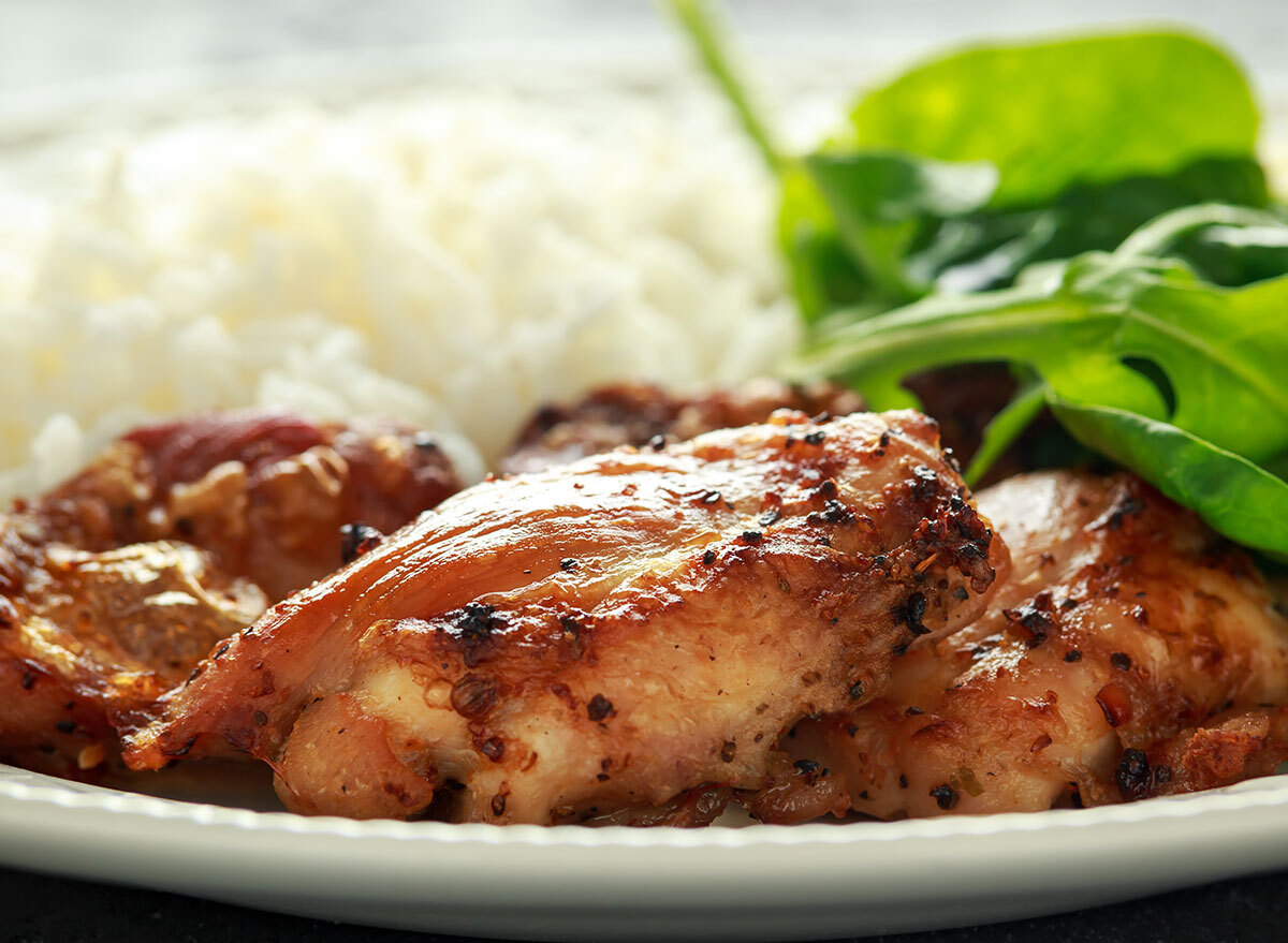 skinless chicken on a plate with greens