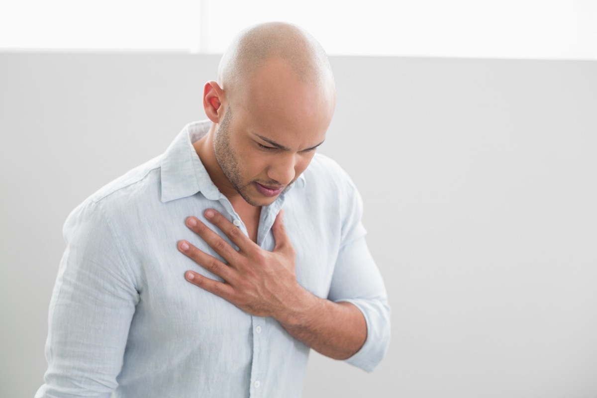 Man holding chest