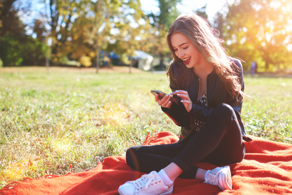 Girl Smiling at Phone Romance