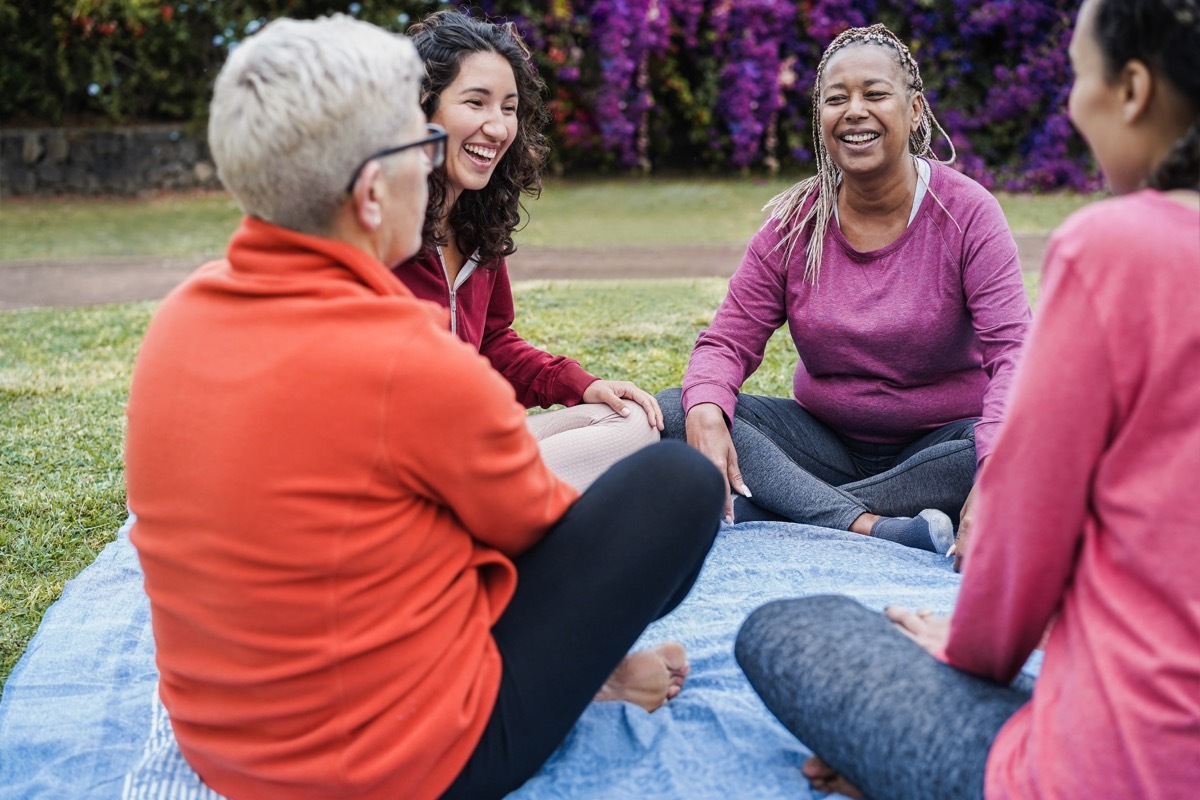 Multi generational women having fun together sitting outdoor