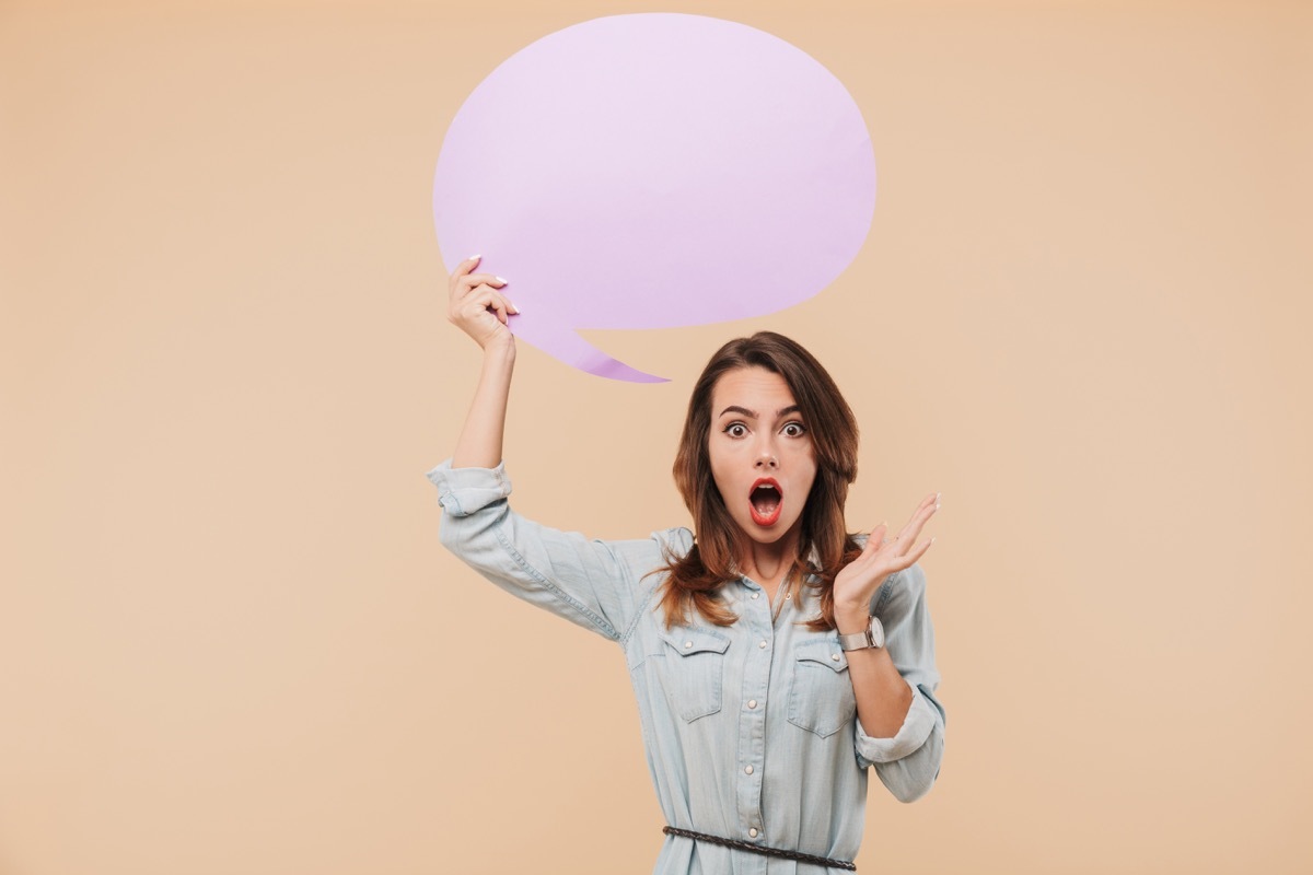 woman holding speech bubble