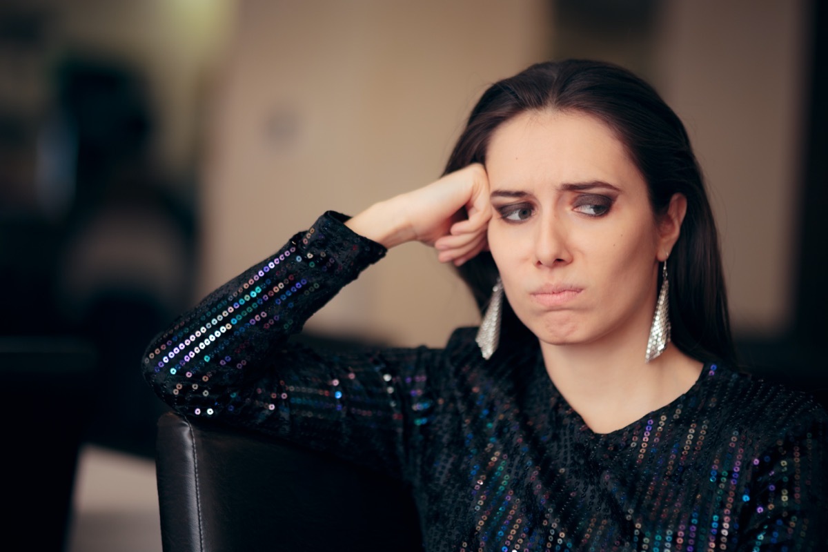 Tired young woman at party