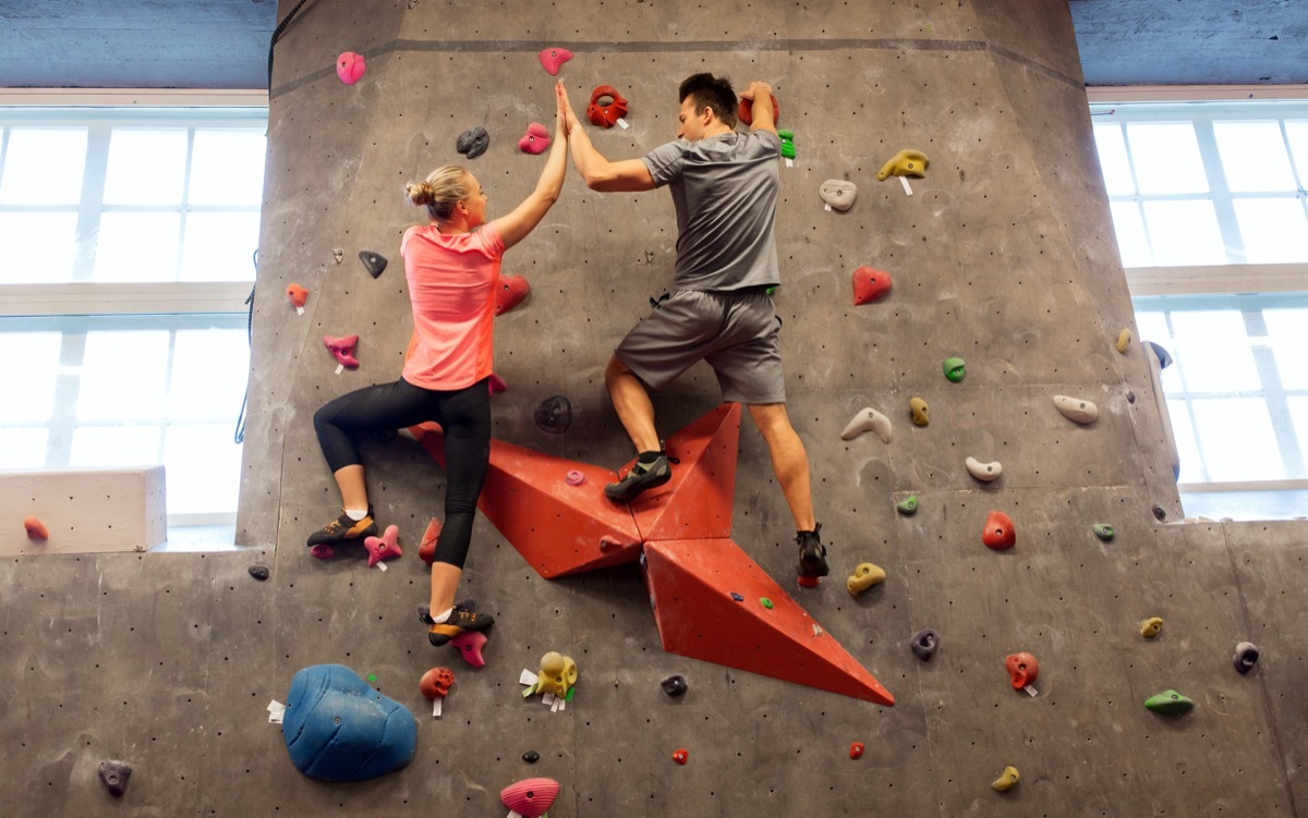 Couple doing rock climbing