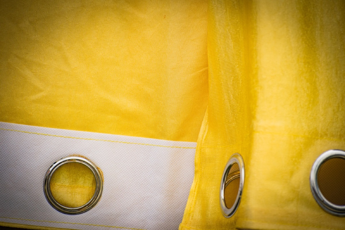 yellow grommet topped curtains, interior design mistakes