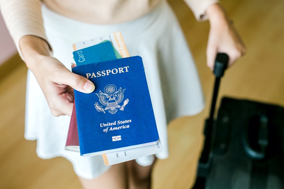 woman holding us passport