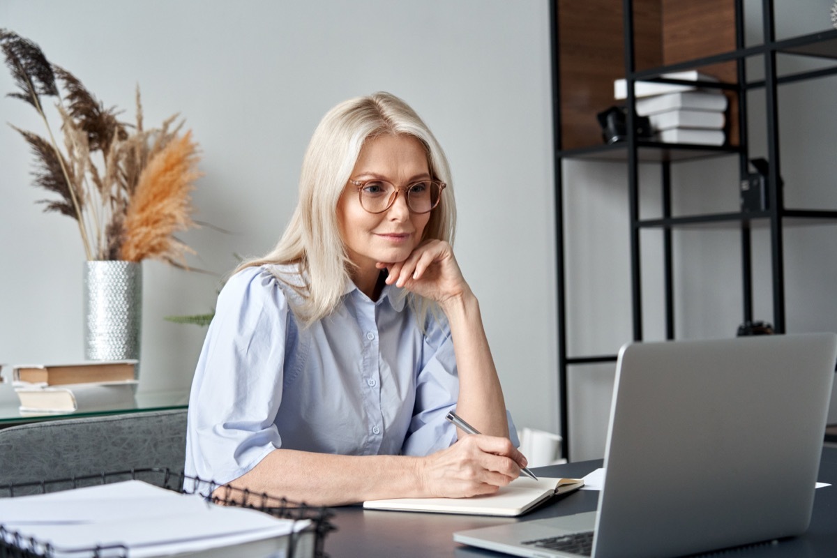 Middle Aged Woman Researching on Computer