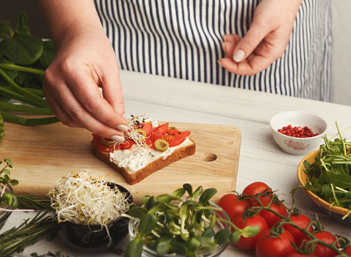 Chef adding toppings to toast for a high cholesterol diet plan