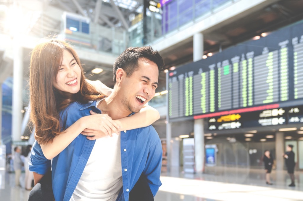 happy couple at airport