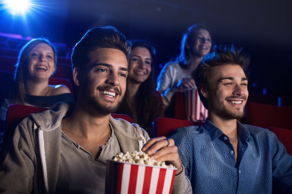 people watching a movie at the movie theatre